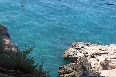 High angle view of rock formation in sea