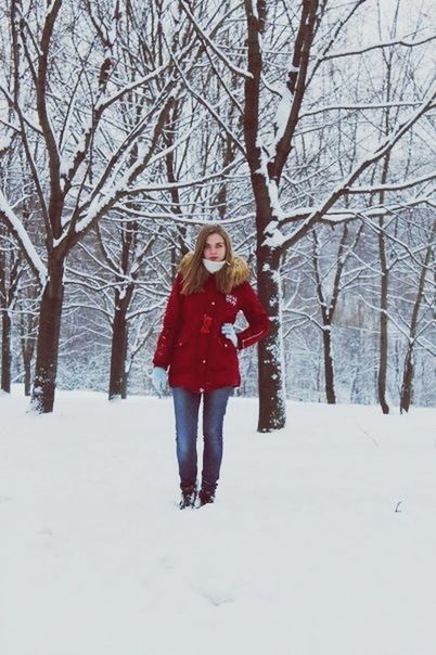 winter, snow, full length, cold temperature, lifestyles, season, leisure activity, tree, warm clothing, bare tree, weather, person, childhood, standing, front view, casual clothing, looking at camera, elementary age