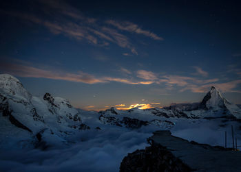 Scenic view of snow covered mountain against sky