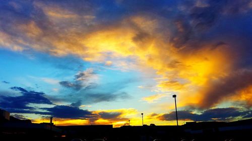 Scenic view of dramatic sky during sunset