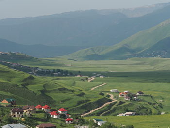 High angle view of agricultural field and mountains