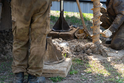 Low section of man working in workshop