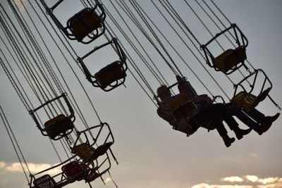 Low angle view of amusement park ride against sky