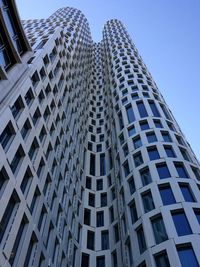 Low angle view of skyscraper against clear sky