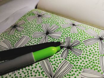 High angle view of green paper on table