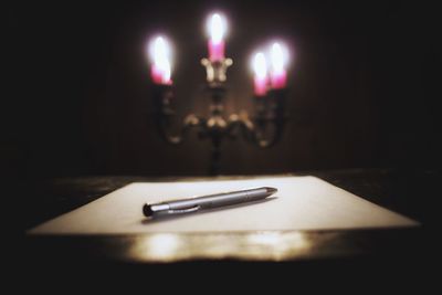 Close-up of candles on table