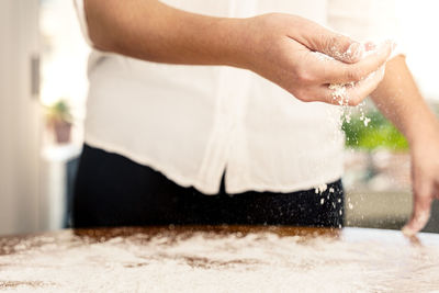 Midsection of woman preparing food