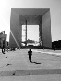 Man walking on bridge