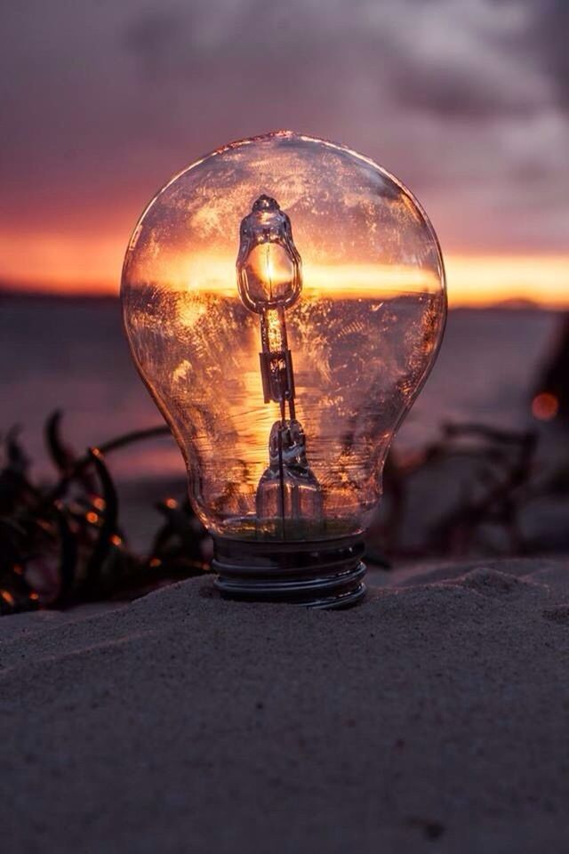 focus on foreground, close-up, sunset, selective focus, beach, sea, water, sky, reflection, no people, outdoors, nature, dusk, surface level, tranquility, orange color, sunlight, single object, metal, transparent