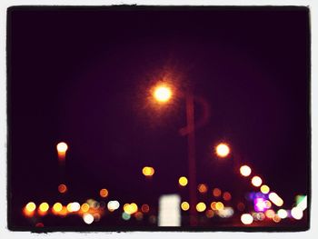 Illuminated street light at night