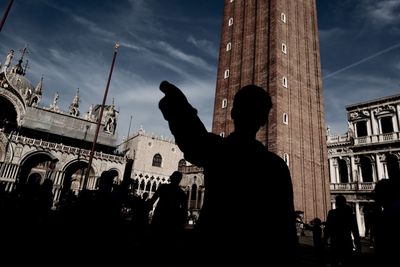 Silhouette of woman against clear sky