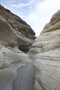 Narrow pathway along rocky walls