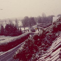 Snow covered road against sky