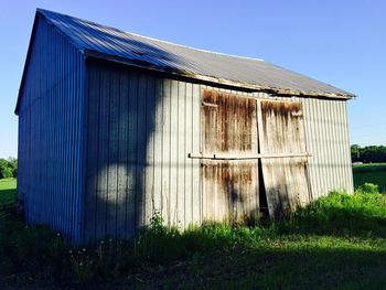 Built structure on field against clear sky