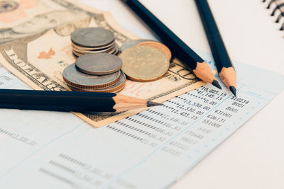 Close-up of coins on paper