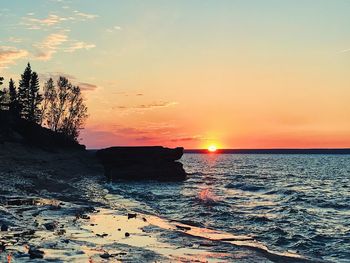 Scenic view of sea against sky during sunset