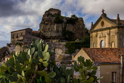 Historic building against cloudy sky