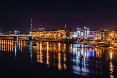 Illuminated city at waterfront