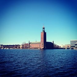 Lighthouse against clear blue sky