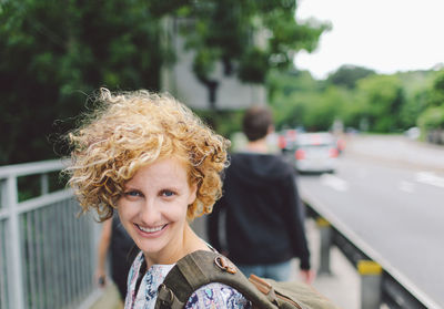 Portrait of happy young woman outdoors 