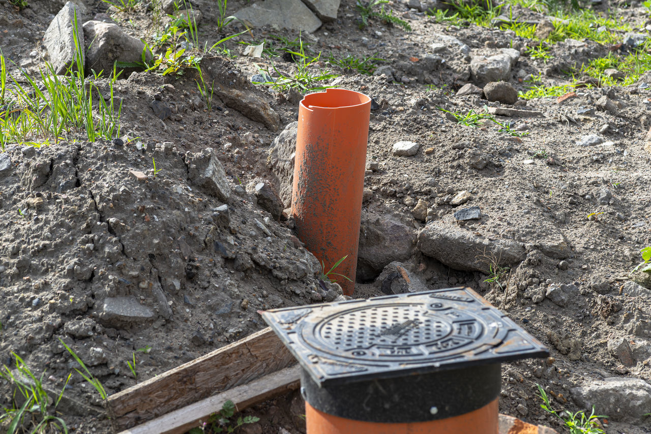 soil, nature, day, garden, plant, high angle view, growth, outdoors, land, container, wood, no people, sunlight, field, metal, dirt, yard, potted plant, can, gardening, litter, backyard