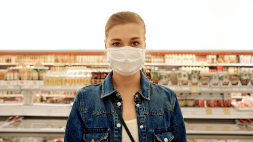 Woman in a protective mask in a store