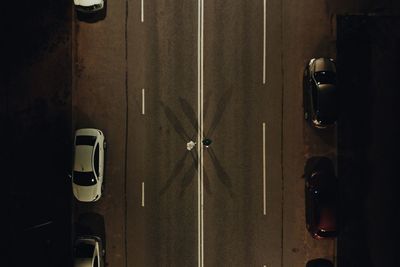 Directly above shot of people and cars on road at night