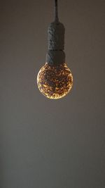 Low angle view of illuminated light bulb