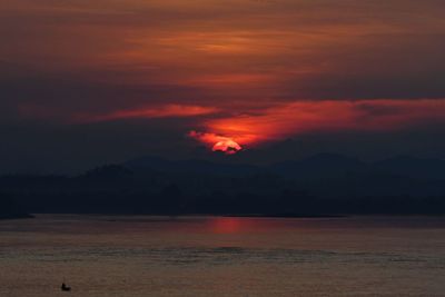 Scenic view of sea against romantic sky at sunset