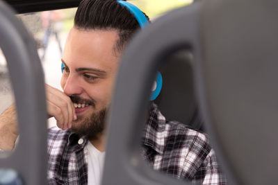 Smiling young man in headphones