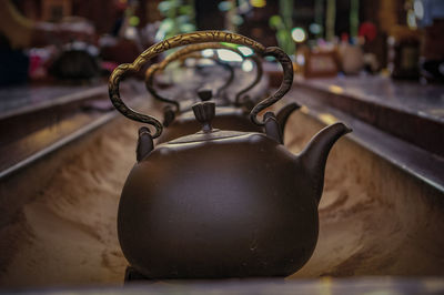 Close-up kettles on sand