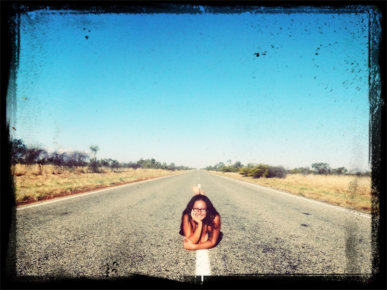 transfer print, the way forward, transportation, road, clear sky, diminishing perspective, auto post production filter, vanishing point, country road, road marking, landscape, copy space, field, tranquil scene, blue, tranquility, sky, asphalt, nature, tree