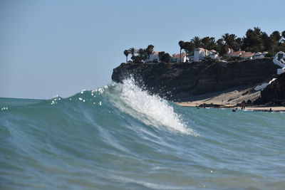 Scenic view of sea against clear sky