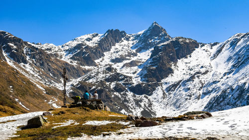 Scenic view of snowcapped mountains against clear sky