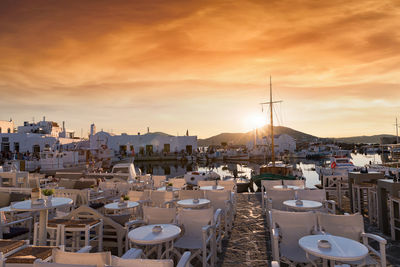 Chairs and table arranged at outdoor restaurant