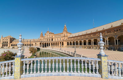 Low angle view of building against blue sky in sevilla 