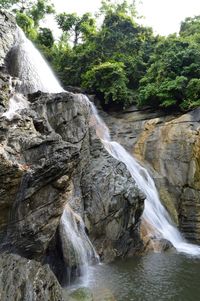 Scenic view of river flowing through rocks