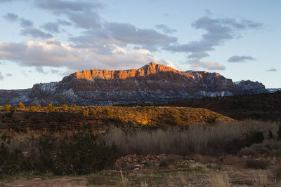 Rock formations on landscape against sky