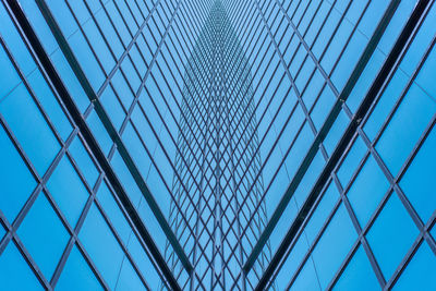 Low angle view of modern building against clear blue sky