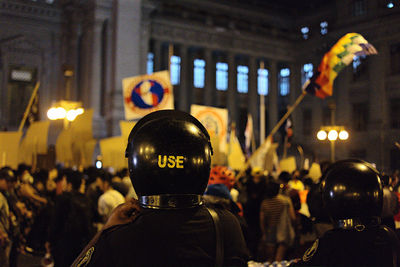 Rear view of police at night manifestation 