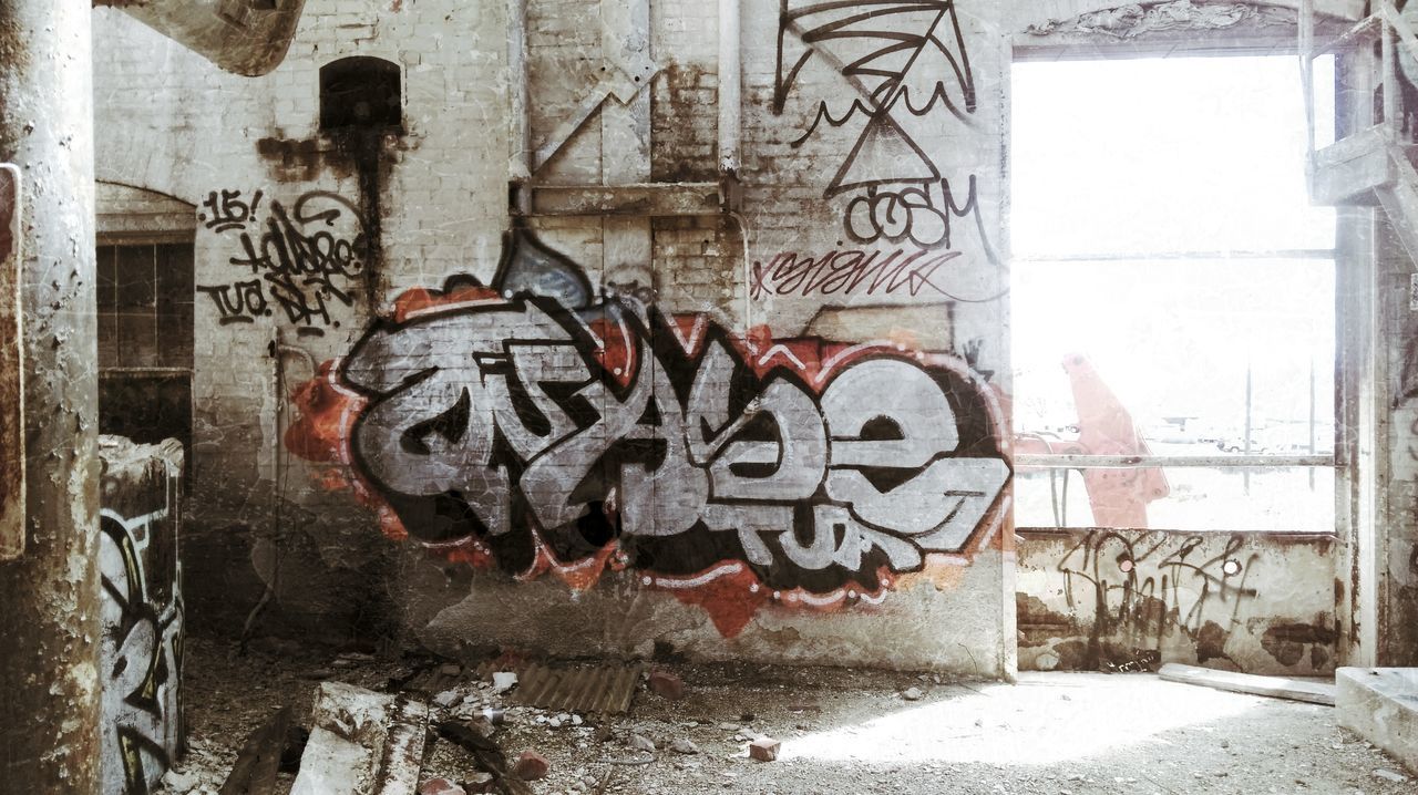 graffiti, architecture, built structure, art, creativity, art and craft, wall - building feature, building exterior, street art, wall, text, human representation, vandalism, old, weathered, window, day, building, mural, no people