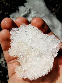 Close-up of hand holding ice cream