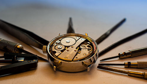 Close-up of clock on table
