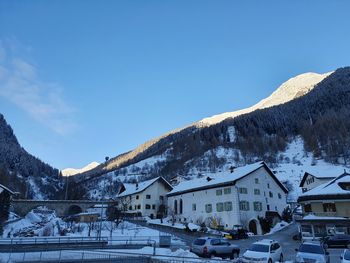 Buildings in city against sky during winter