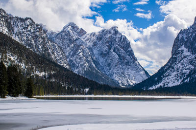 Scenic view of snowcapped mountains against sky during winter