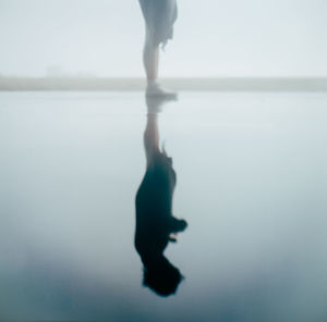 Low section of woman in sea