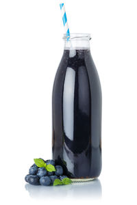 Close-up of drink against white background