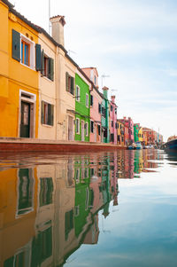 Canal amidst buildings in city