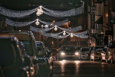 Illuminated city street at night