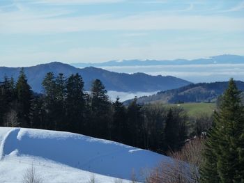 Scenic view of mountains against sky during winter